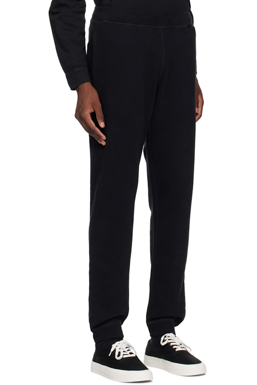 Slim-fit French terry sweatpants.

· Concealed drawstring at elasticized waistband
· Three-pocket styling
· Elasticized cuffs

Supplier color: Black