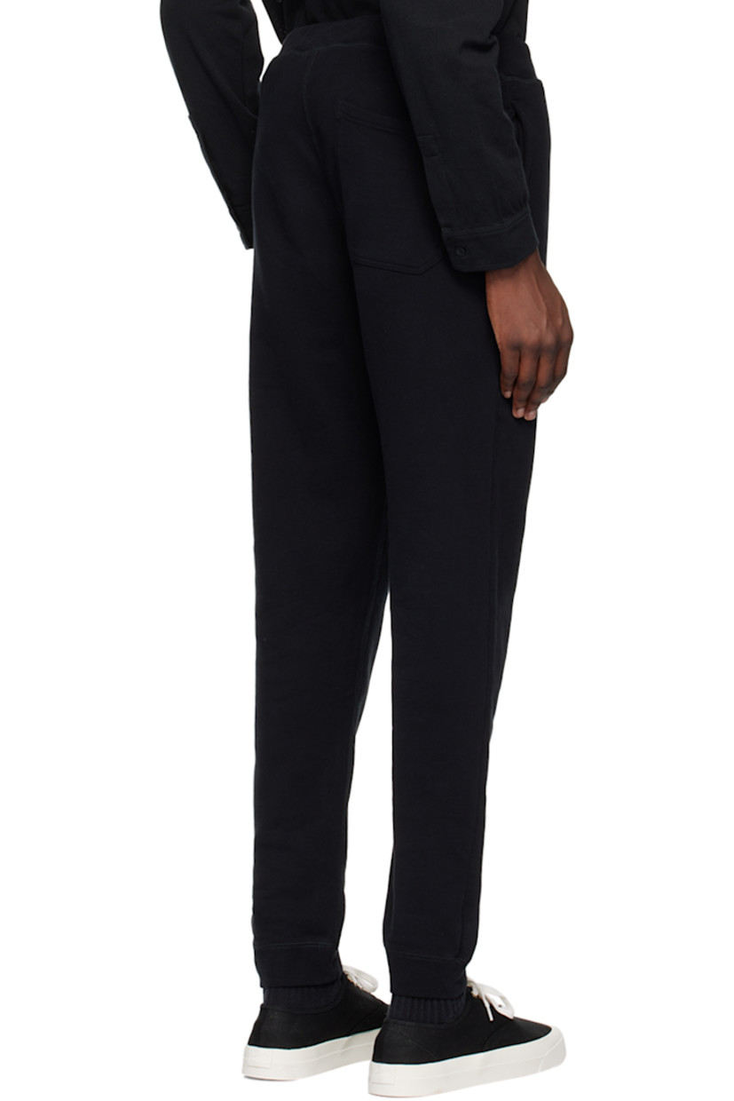 Slim-fit French terry sweatpants.

· Concealed drawstring at elasticized waistband
· Three-pocket styling
· Elasticized cuffs

Supplier color: Black