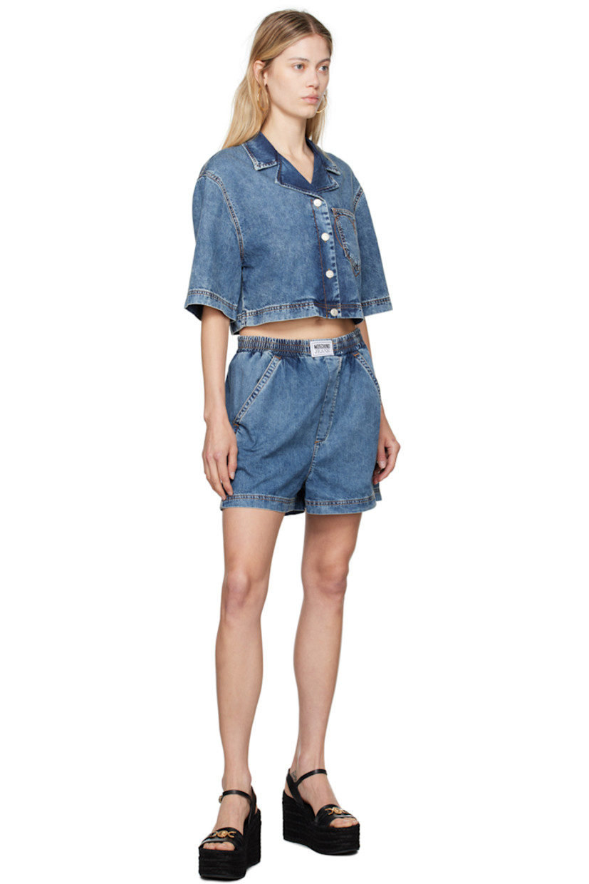 Lightweight relaxed-fit non-stretch denim shorts. Fading throughout. 

· High-rise
· Logo patch at elasticized waistband
· Four-pocket styling
· Graphic embroidered at back pockets
· Contrast stitching in tan 

Supplier color: Fantasia blue