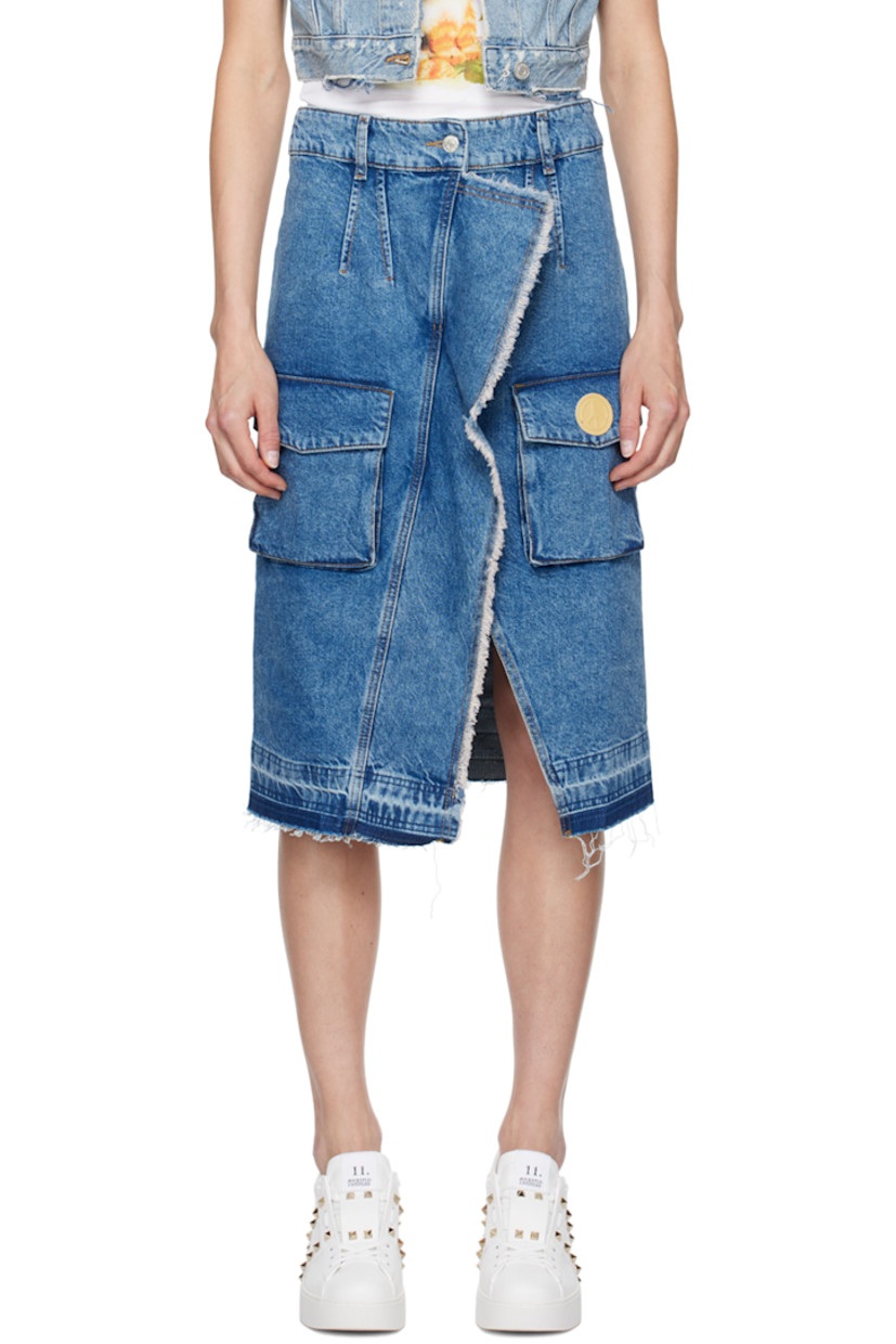 Non-stretch denim skirt. Fading and frayed edges throughout.

· Belt loops
· Two-pocket styling
· Zip-fly
· Bellows pockets and graphic patch at front
· Central vent at front hem
· Contrast stitching in tan

Supplier color: Fantasia blue