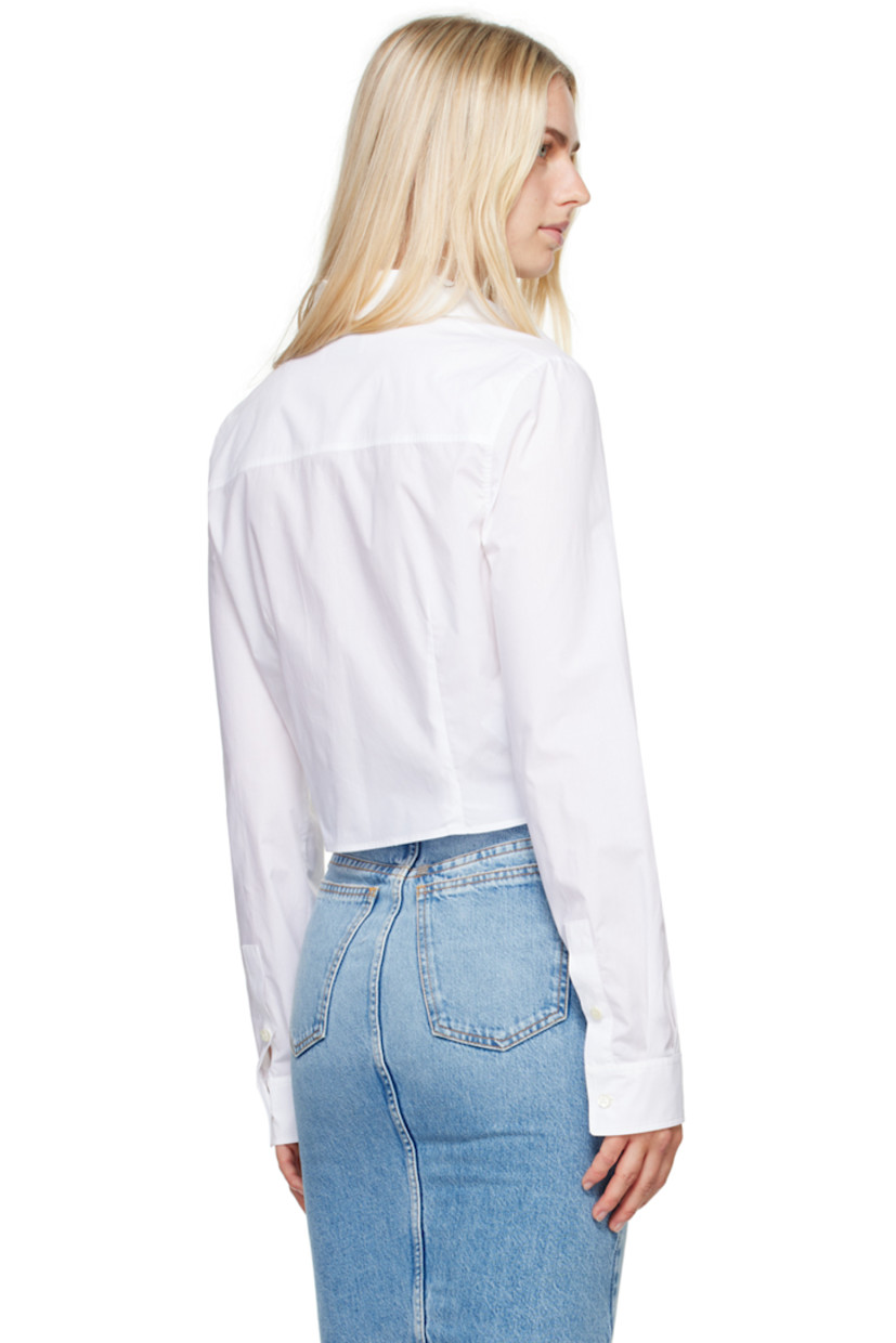 Cotton poplin shirt.

· Spread collar
· Button closure
· Logo graphic printed at chest
· Darts at front and back
· Cropped hem
· Single-button barrel cuffs

Supplier color: Multi white