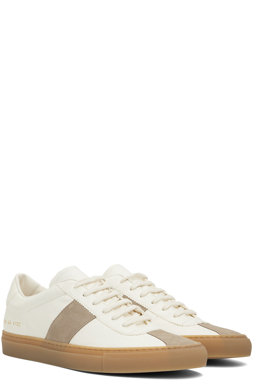 Low-top buffed lambskin and calfskin suede sneakers in off-white.

· Serrated detailing at lace-up closure
· Padded collar
· Signature series stamp at outer side
· Buffed sheepskin and suede lining
· Treaded rubber sole

Supplier color: Off white