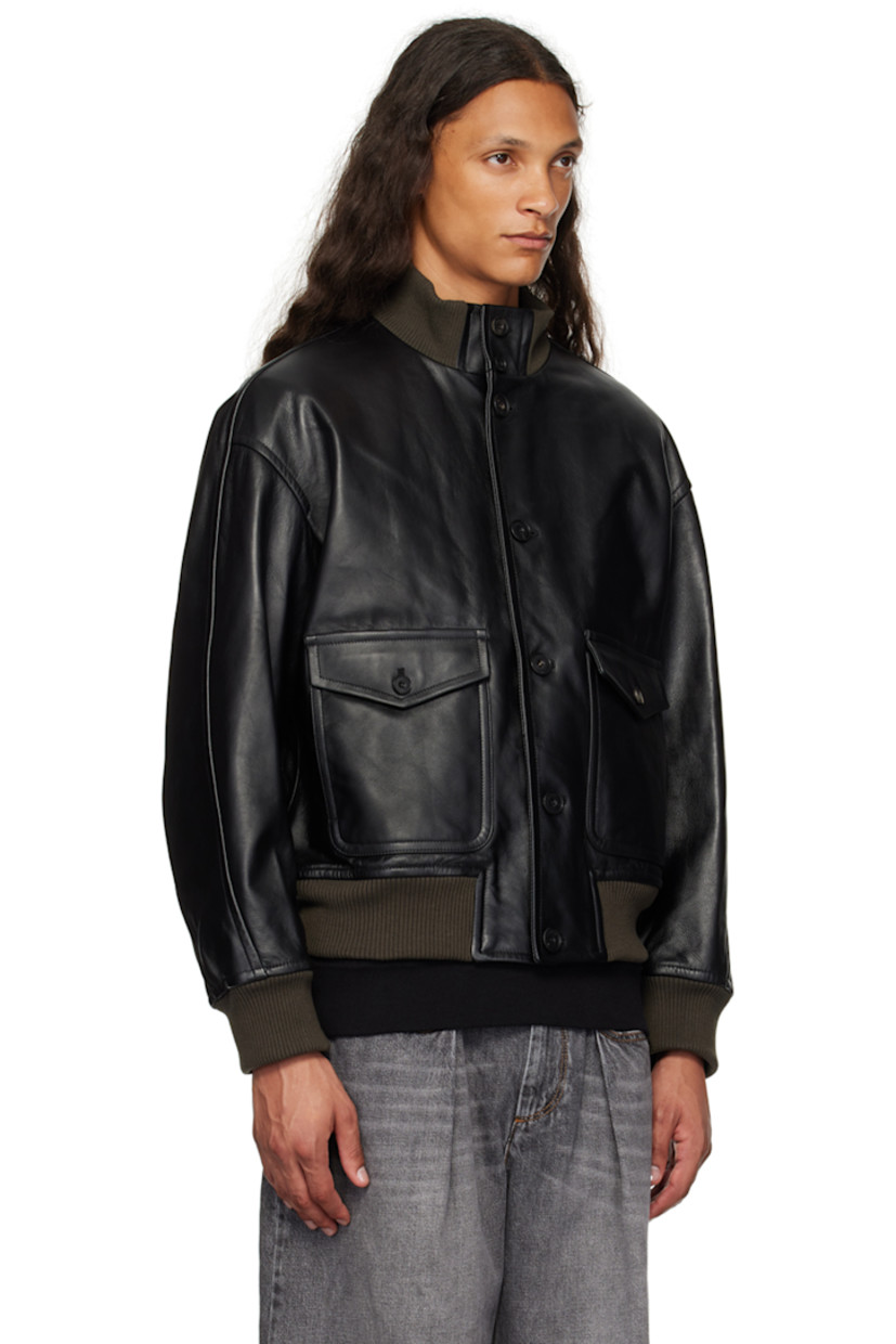 Padded grained leather jacket.

· Rib knit stand collar, hem, and cuffs
· Button closure
· Flap pockets
· Patch pocket at interior 
· Full quilted twill lining

Supplier color: Black