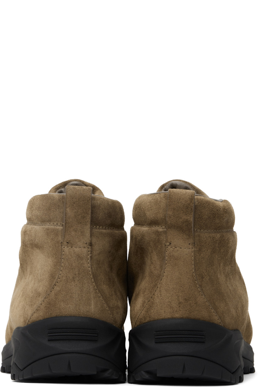 High-top suede sneakers in beige.

· Elasticized criss-crossing straps at vamp
· Bungee-style drawstring closure
· Logo bonded at padded tongue
· Padded collar
· Pull-loop at heel tab
· Logo embossed at heel
· Buffed leather lining
· Treaded Vibram® Arctic Grip rubber sole

Supplier color: Beige