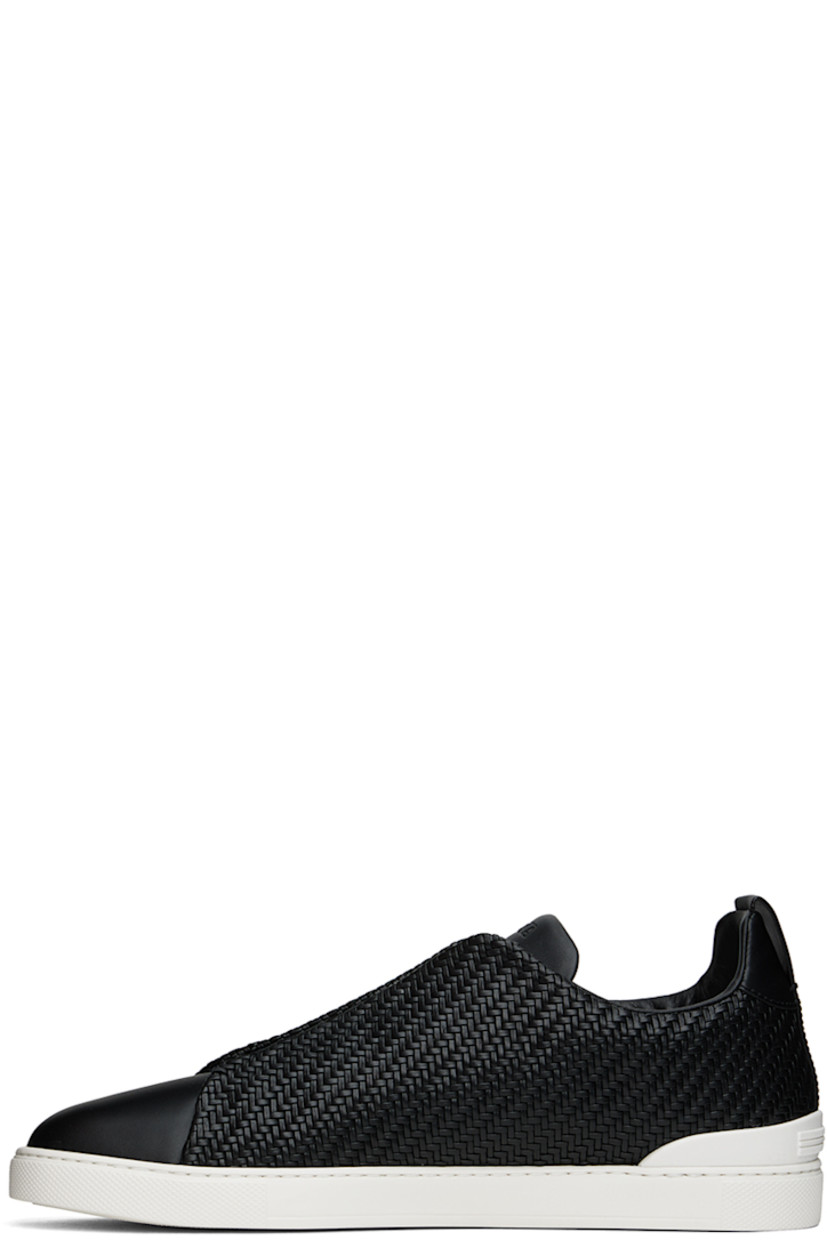 Low-top woven PELLETESSUTA™ buffed lambskin and buffed calfskin slip-on sneakers in black.

· Elasticized criss-crossing straps at vamp
· Logo embossed at padded tongue
· Padded collar
· Pull-loop at heel tab
· Rubberized logo patch at heel counter
· Removable Sanitized® footbed
· Buffed leather lining
· Treaded rubber sole

Supplier color: Black