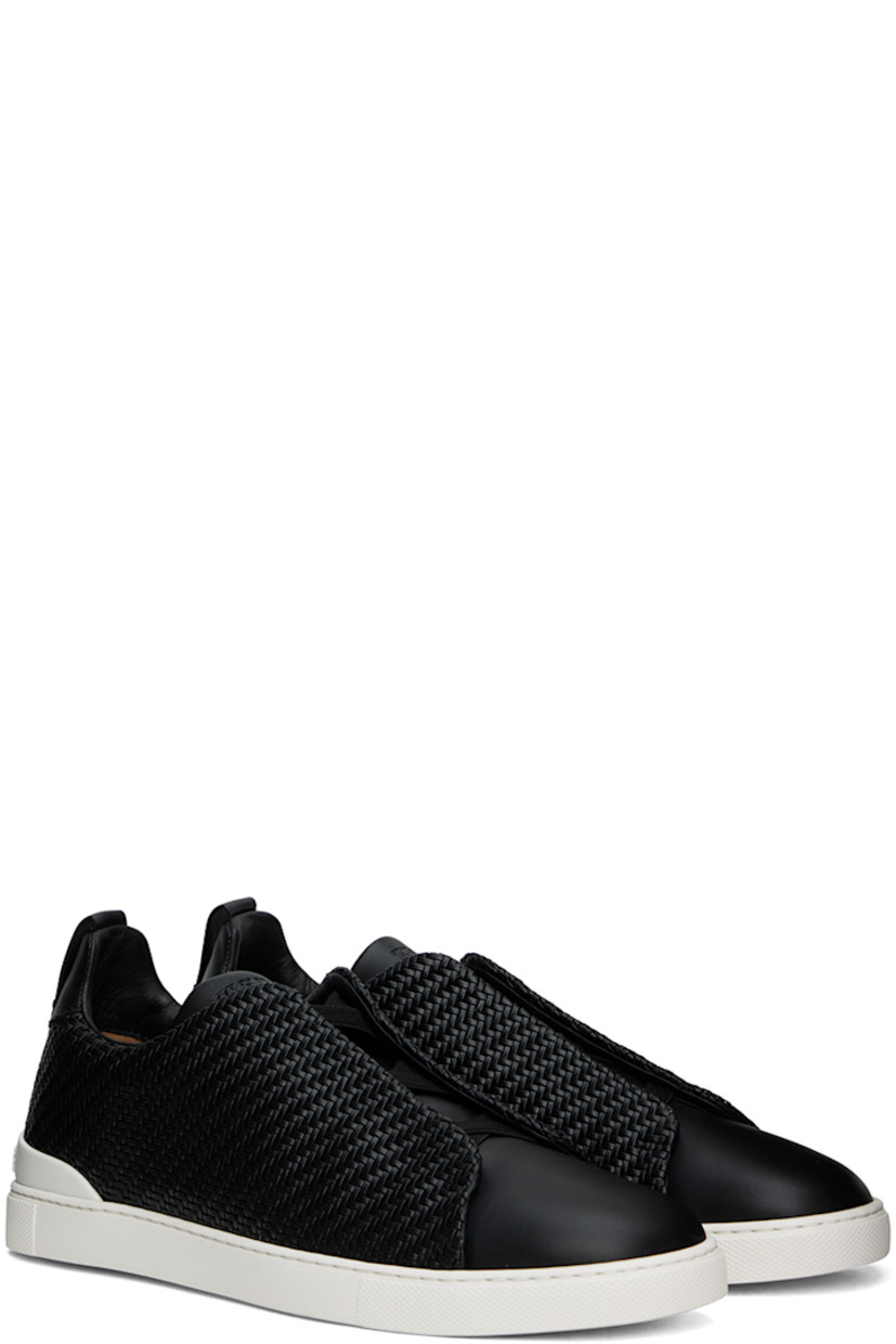 Low-top woven PELLETESSUTA™ buffed lambskin and buffed calfskin slip-on sneakers in black.

· Elasticized criss-crossing straps at vamp
· Logo embossed at padded tongue
· Padded collar
· Pull-loop at heel tab
· Rubberized logo patch at heel counter
· Removable Sanitized® footbed
· Buffed leather lining
· Treaded rubber sole

Supplier color: Black