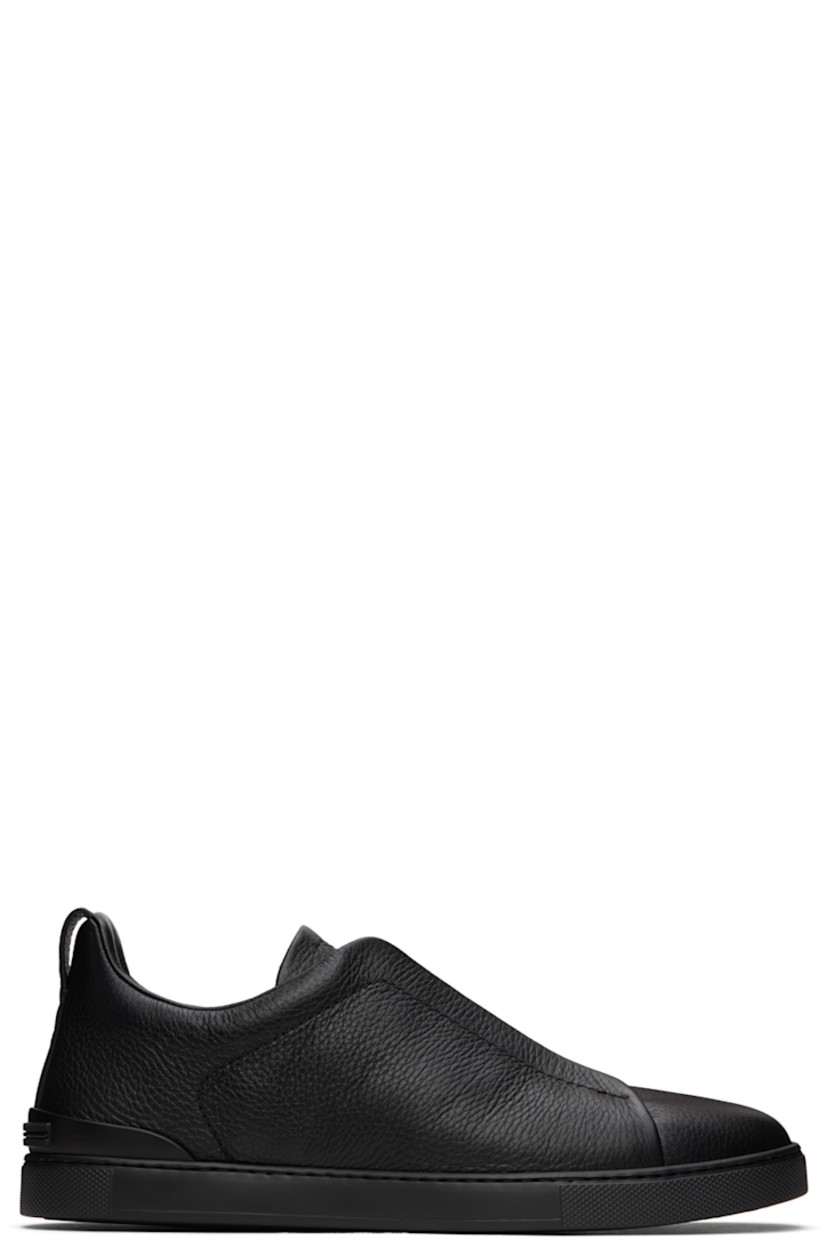 Low-top grained deerskin sneakers in black.

· Elasticized criss-crossing straps at vamp
· Logo embossed at padded tongue
· Padded collar
· Pull-loop at heel tab
· Rubberized logo patch at heel counter
· Removable cushioned Sanitized® insole
· Buffed leather lining
· Treaded rubber sole

Supplier color: Black