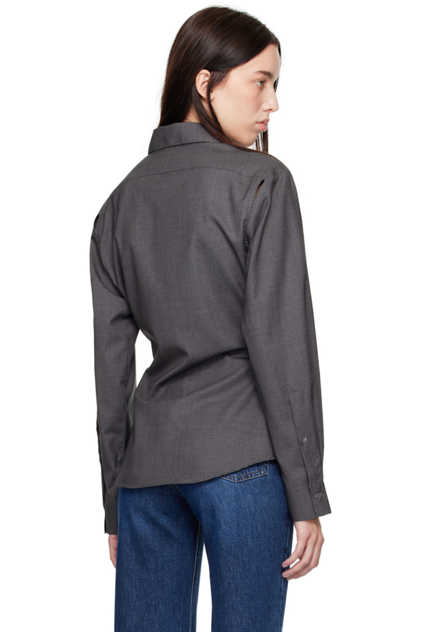 Plain-woven stretch virgin wool shirt. 

· Spread collar
· Button closure
· Curved hem
· Cutout at armscyes for alternate styling 
· Single-button barrel cuffs

Supplier color: Dark grey melange