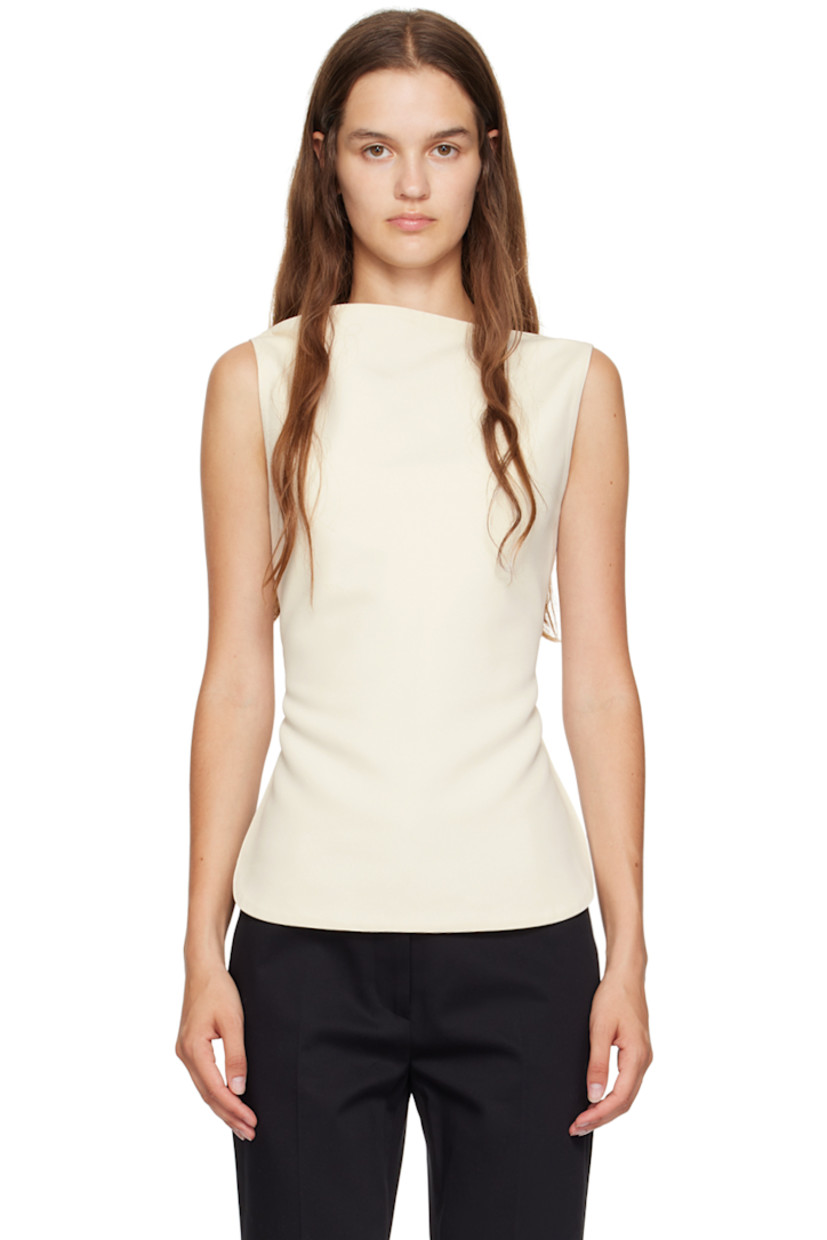 Polyester twill tank top. 

· Cowl neck
· Curved hem
· Adjustable halter strap 
· Self-tie strap at open back

Supplier color: Off white