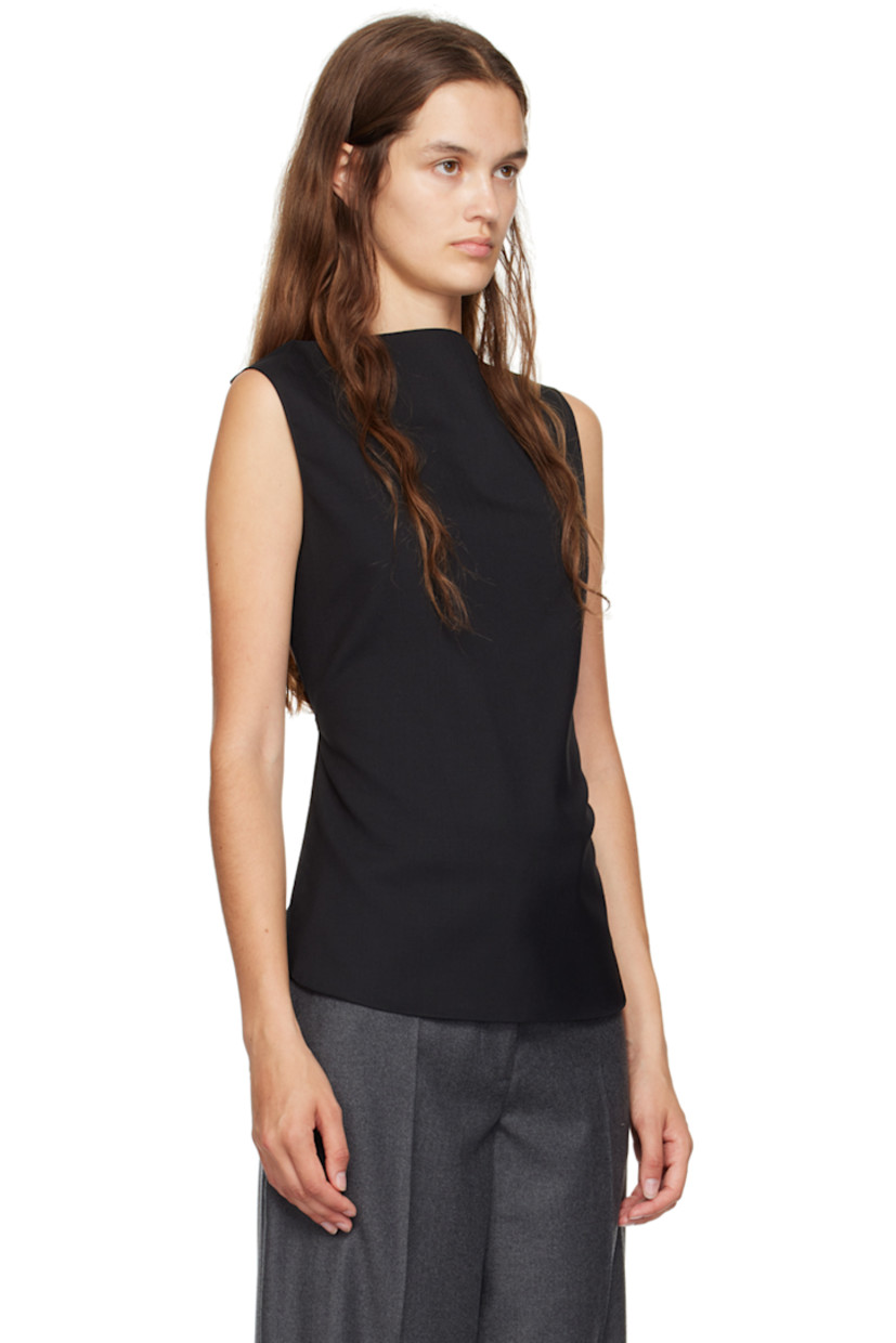 Plain-woven virgin wool tank top. 

· Cowl neck
· Curved hem
· Adjustable halter strap 
· Self-tie strap at open back

Supplier color: Black