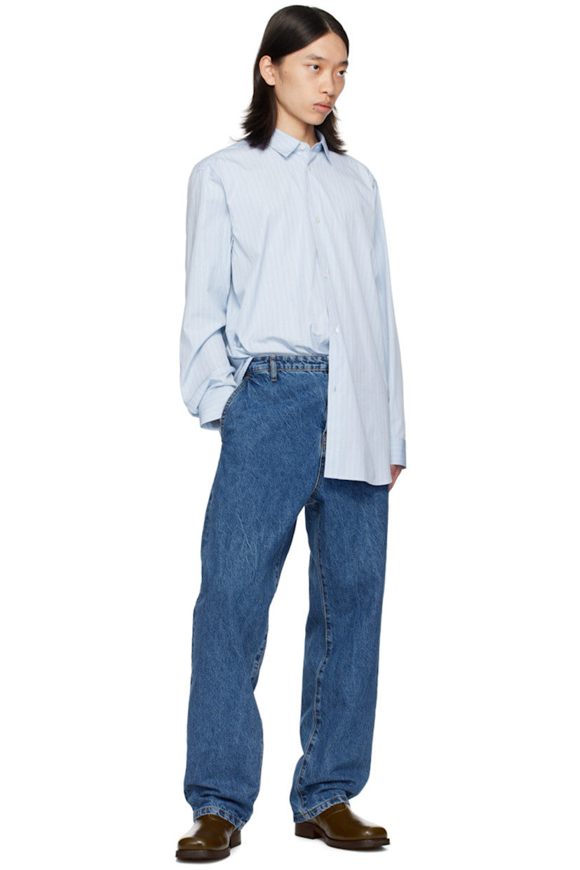Cotton poplin shirt. Stripes throughout. 

· Spread collar
· Button closure
· Shirttail hem
· Logo flag at side seam
· Single-button barrel cuffs
· Box pleat at back yoke
· Mother-of-pearl hardware

Supplier color: Sky blue/White