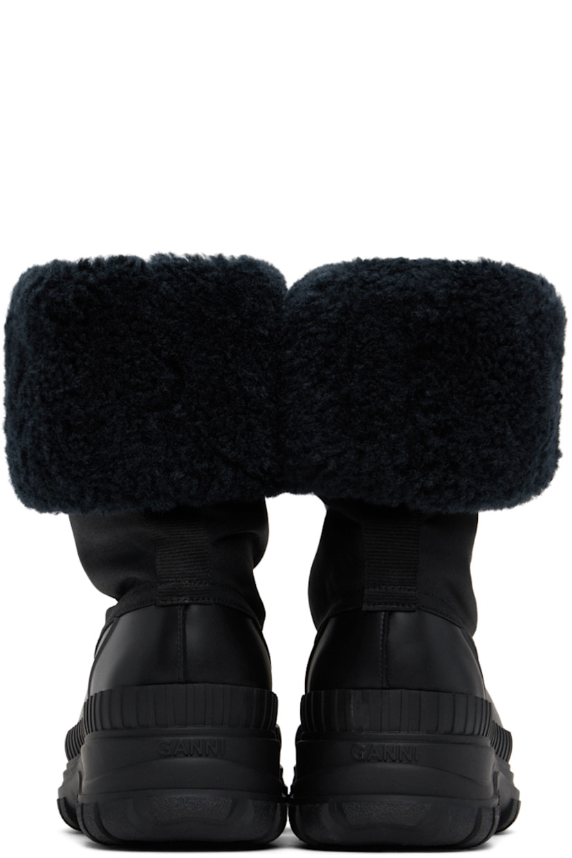 Ankle-high canvas and rubber boots in black.

· Rolled collar
· Extended rubber welt
· Faux-shearling lining
· Logo embossed at heel 
· Lugged rubber sole
· Heel: H2"

Supplier color: Black