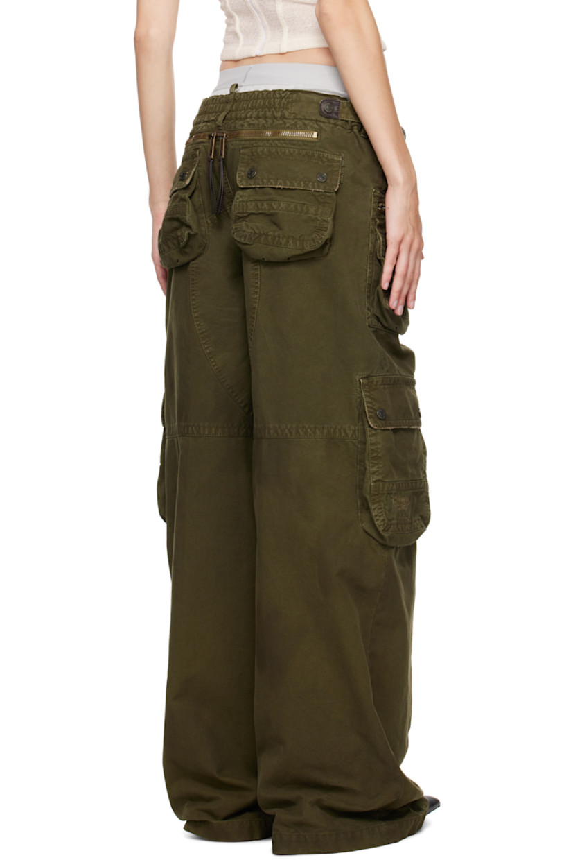 Cotton canvas cargo pants. Distressing and buffed leather trim throughout. 

· Belt loops
· D-rings at partially elasticized waistband
· Four-pocket styling 
· Logo flag at zip-fly
· Cargo and zip pockets at front legs
· Gusset at inseam
· Adjustable press-stud tabs at back waistband 
· Two-way zip vent at back
· Logo-engraved antiqued bronze-tone hardware

Supplier color: Khaki