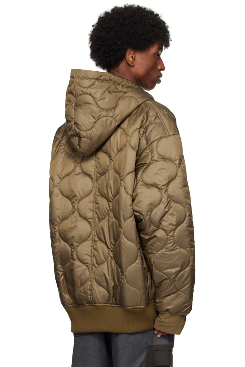 Padded and quilted polyester satin jacket.

· Hood at collar
· Zip closure
· Embroidered logo patch at chest
· Patch pockets
· Rib knit hem
· Thumbhole at inset jersey cuffs
· Locker loop at back collar
· Full satin lining

Supplier color: Brown