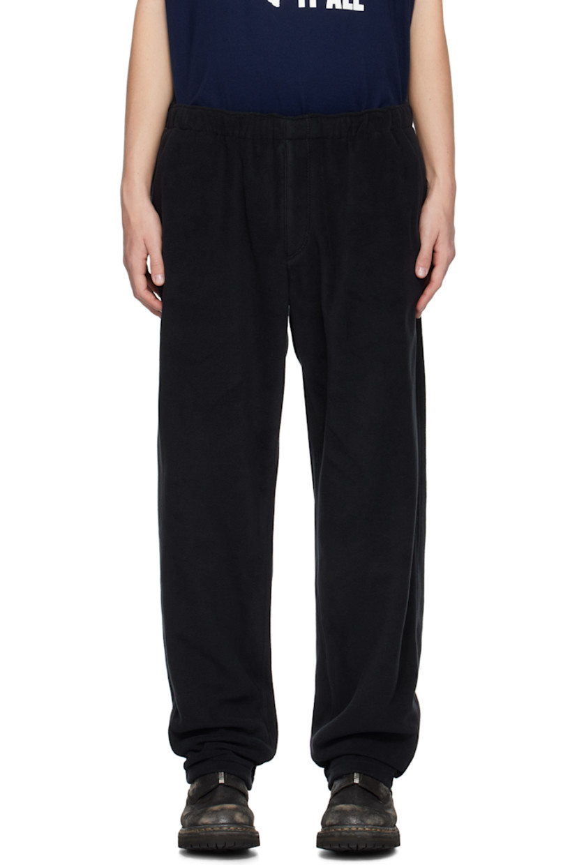 Polartec® polyester fleece trousers.

· Concealed drawstring at elasticized waistband
· Four-pocket styling
· Zip-fly
· Logo graphic embroidered at leg
· Locker loop at back waistband
· Partial cotton poplin lining

Supplier color: Black