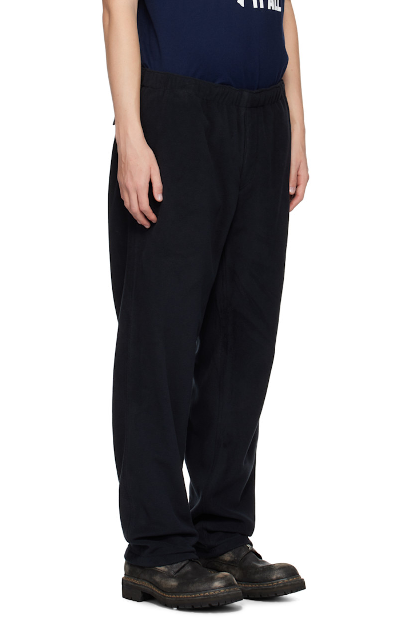 Polartec® polyester fleece trousers.

· Concealed drawstring at elasticized waistband
· Four-pocket styling
· Zip-fly
· Logo graphic embroidered at leg
· Locker loop at back waistband
· Partial cotton poplin lining

Supplier color: Black