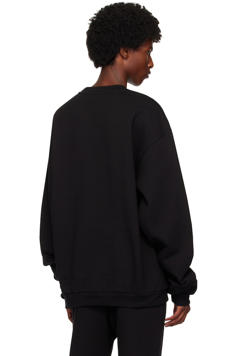 Cotton fleece sweatshirt.

· Rib knit crewneck, hem, and cuffs
· Logo graphic printed at front
· Dropped shoulders

Supplier color: Black