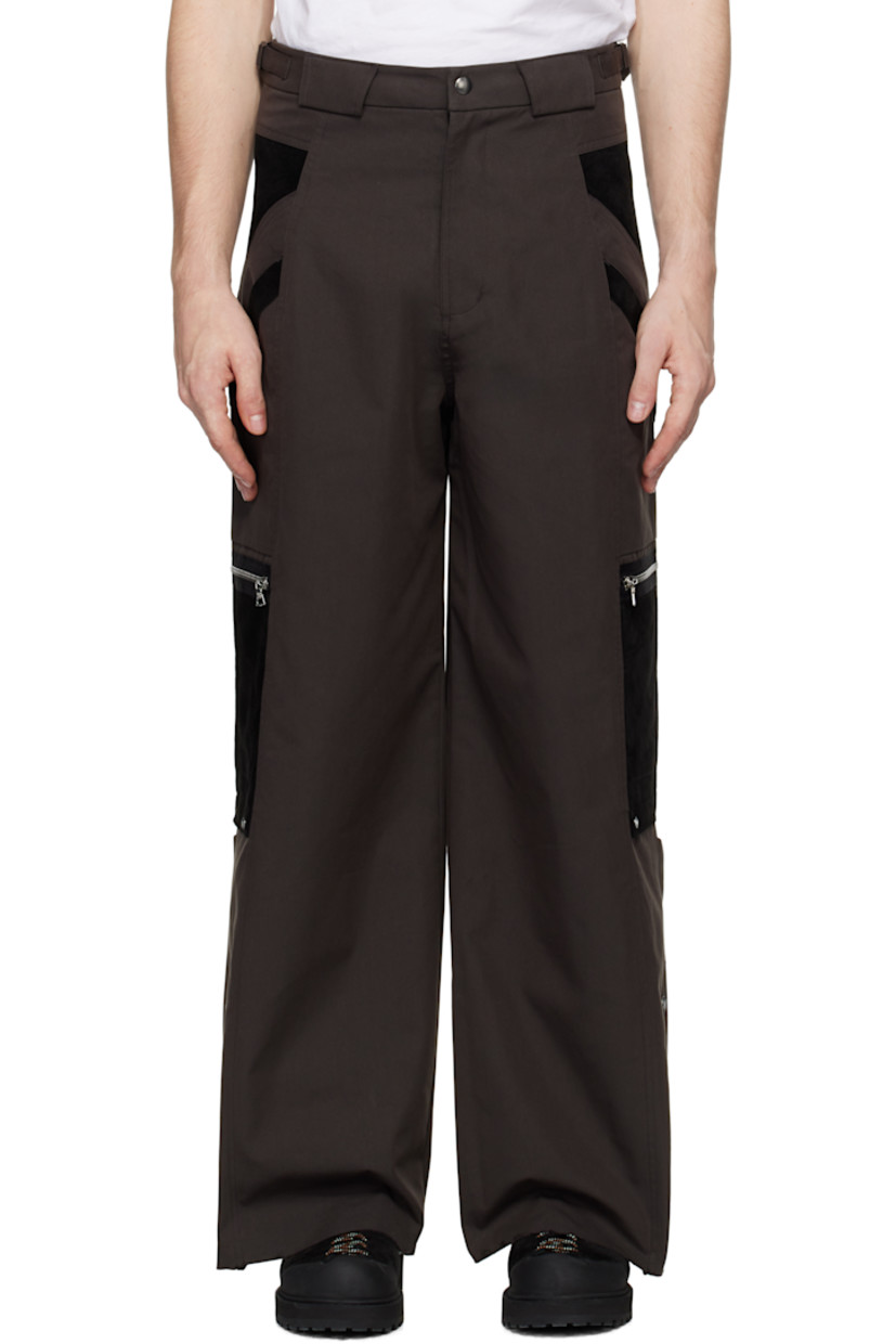 Polyester- and cotton-blend twill and suede cargo pants. 

· Paneled construction 
· Belt loops
· Adjustable cinch tabs at waistband
· Four-pocket styling
· Zip-fly
· Patch and zip pockets at outseams
· Press-stud expansion panel and raw edge at cuffs

Supplier color: Dark brown
