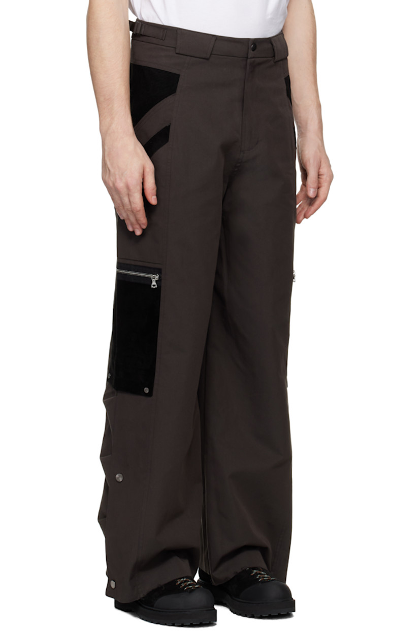Polyester- and cotton-blend twill and suede cargo pants. 

· Paneled construction 
· Belt loops
· Adjustable cinch tabs at waistband
· Four-pocket styling
· Zip-fly
· Patch and zip pockets at outseams
· Press-stud expansion panel and raw edge at cuffs

Supplier color: Dark brown
