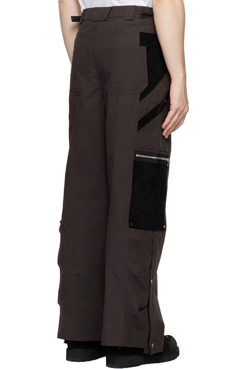 Polyester- and cotton-blend twill and suede cargo pants. 

· Paneled construction 
· Belt loops
· Adjustable cinch tabs at waistband
· Four-pocket styling
· Zip-fly
· Patch and zip pockets at outseams
· Press-stud expansion panel and raw edge at cuffs

Supplier color: Dark brown