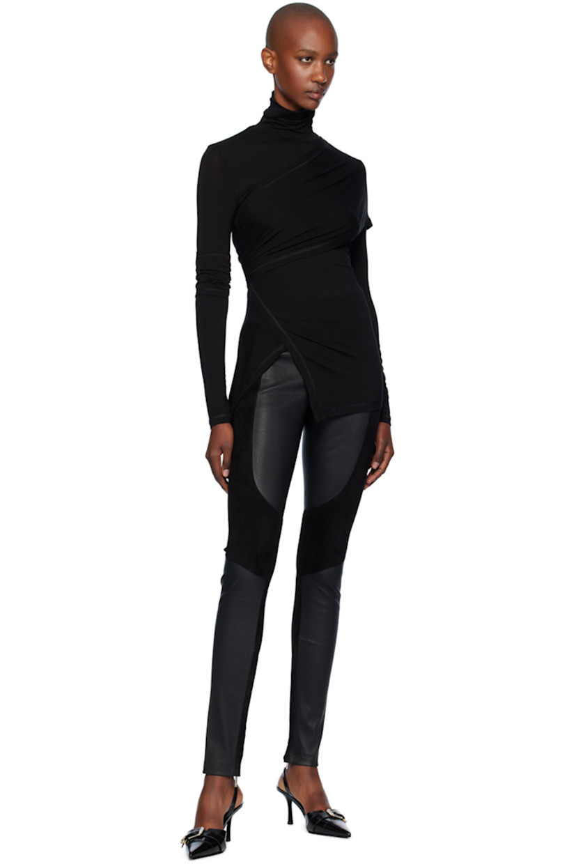 Stretch lyocell jersey turtleneck. Draping throughout.

· Wrap construction
· Asymmetric hem
· Ruched panel at sleeve
· Cutouts at back

Supplier color: Black