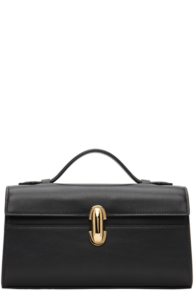 Buffed calfskin top handle bag in black.

· Fixed carry handle
· Turn-lock flap
· Card slot at interior
· H4.75" x W8.5" x D2"

Supplier color: Black