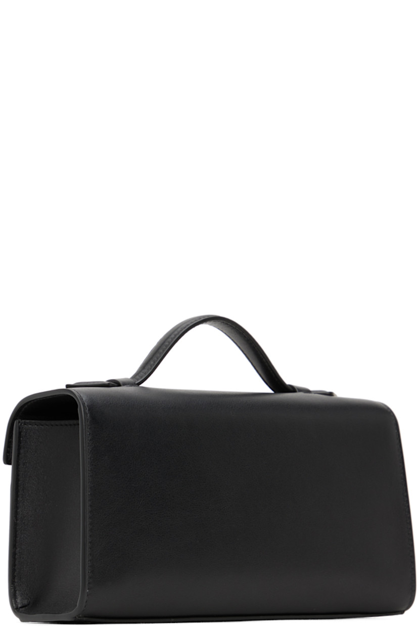 Buffed calfskin top handle bag in black.

· Fixed carry handle
· Turn-lock flap
· Card slot at interior
· H4.75" x W8.5" x D2"

Supplier color: Black