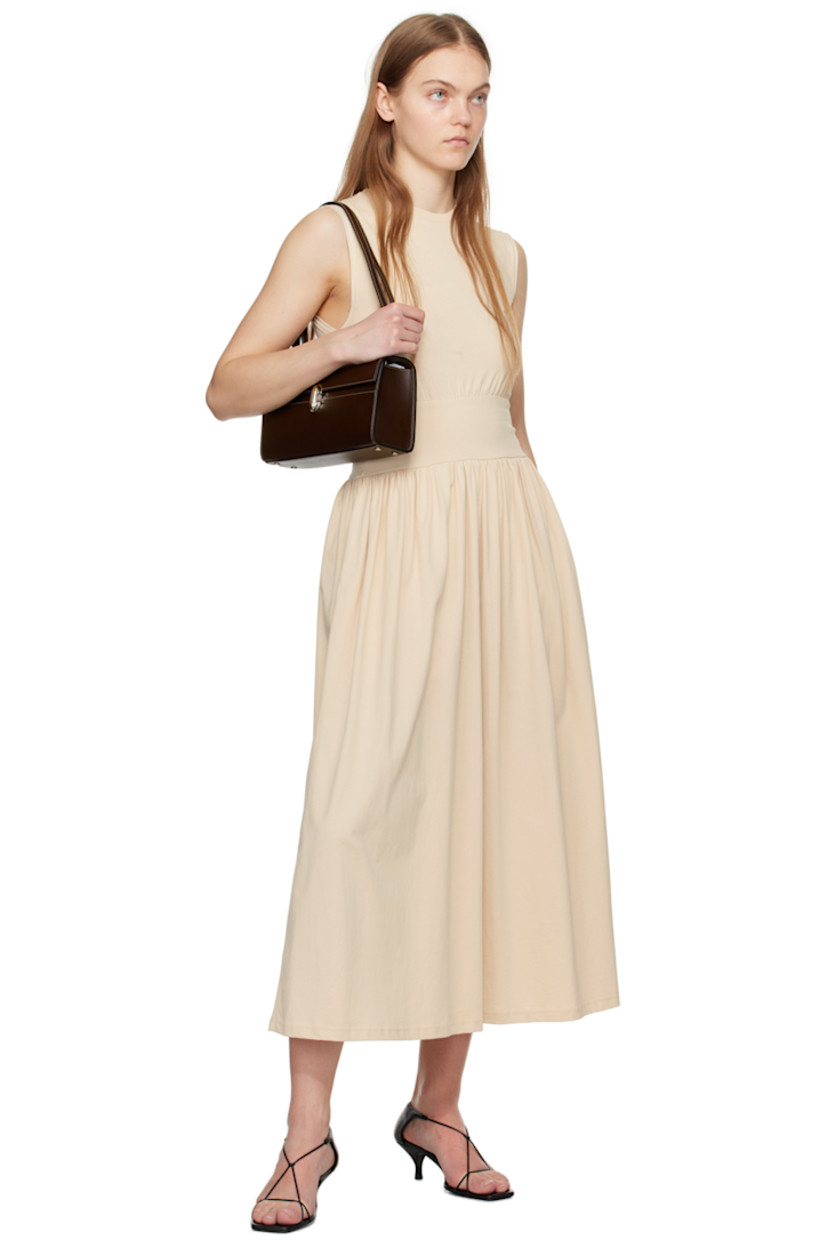 Buffed calfskin shoulder bag in brown.

· Convertible crossbody strap
· Bumper studs at base
· Turn-lock flap
· Patch pocket at interior
· Contrast stitching in off-white
· H5.5" x W10" x D2.25"

Supplier color: Coffee