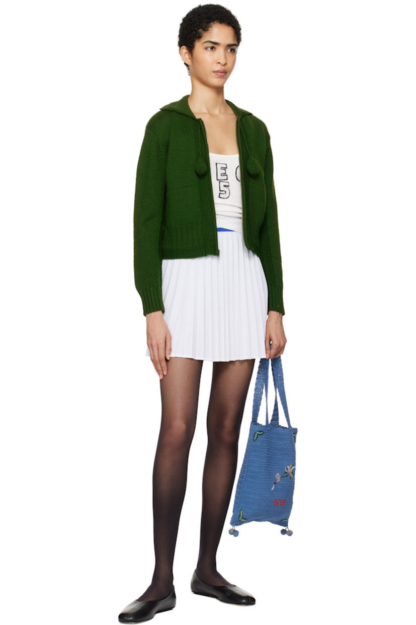 Stretch polyester mesh miniskirt. Pleats throughout.

· Stripes at waistband
· Embroidered logo at front hem
· Zip closure at side seam

Part of a limited run of 73.

Supplier color: Cream