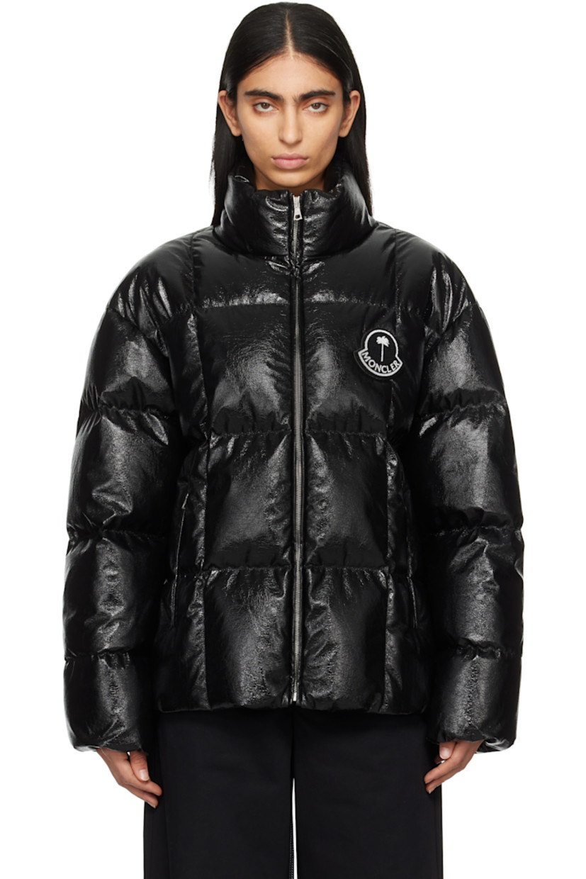Down-filled and quilted faux-leather jacket. Crinkled texture throughout. 

· DIST-certified down
· Stand collar
· Zip closure 
· Bouclé logo patch at chest
· Zip pockets
· Elasticized cuffs 
· Bungee-style drawstring at hem 
· Logo patch at back collar and interior
· Full satin lining

Part of the Moncler Genius x Palm Angels collaboration.

Supplier color: Black

Fill: 100% white goose down.