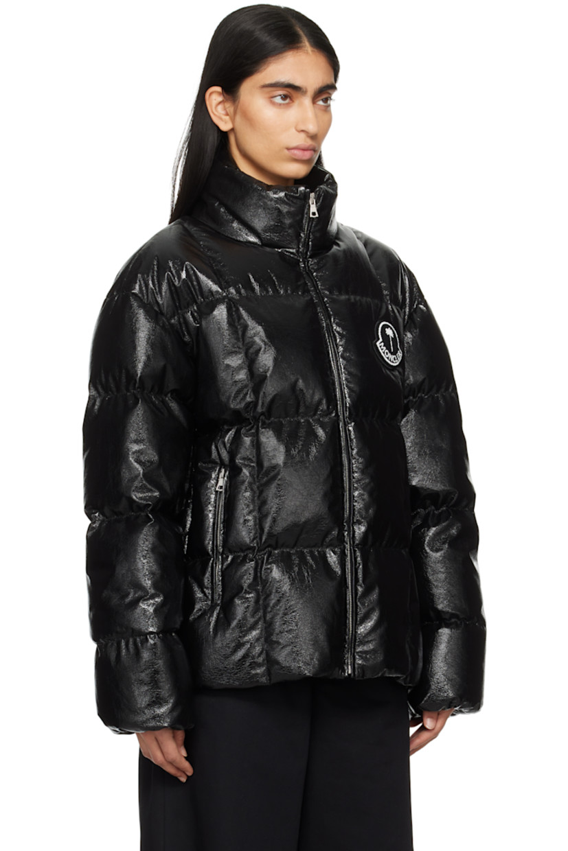 Down-filled and quilted faux-leather jacket. Crinkled texture throughout. 

· DIST-certified down
· Stand collar
· Zip closure 
· Bouclé logo patch at chest
· Zip pockets
· Elasticized cuffs 
· Bungee-style drawstring at hem 
· Logo patch at back collar and interior
· Full satin lining

Part of the Moncler Genius x Palm Angels collaboration.

Supplier color: Black

Fill: 100% white goose down.