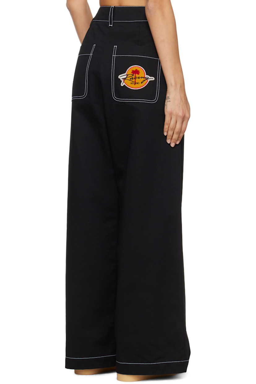 Cotton twill trousers. 

· Belt loops 
· Panel with logo flag at waistband 
· Zip-fly 
· Four-pocket styling 
· Bouclé logo patch at back pocket
· Contrast stitching in white

Part of the Moncler Genius x Palm Angels collaboration.

Supplier color: Black