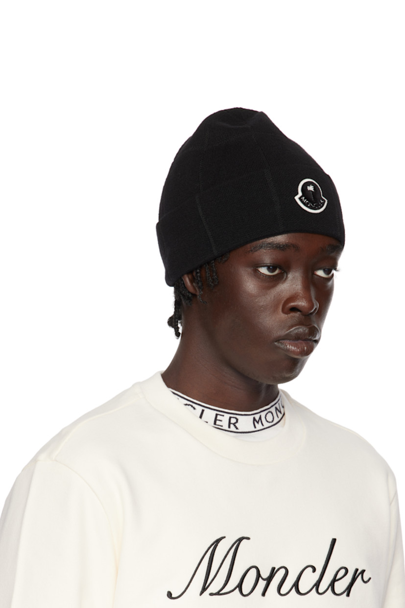 Knit stretch virgin wool-blend beanie in black. Logo patch at rolled brim. 

Part of the Moncler Genius x Palm Angels collaboration.

Supplier color: Black