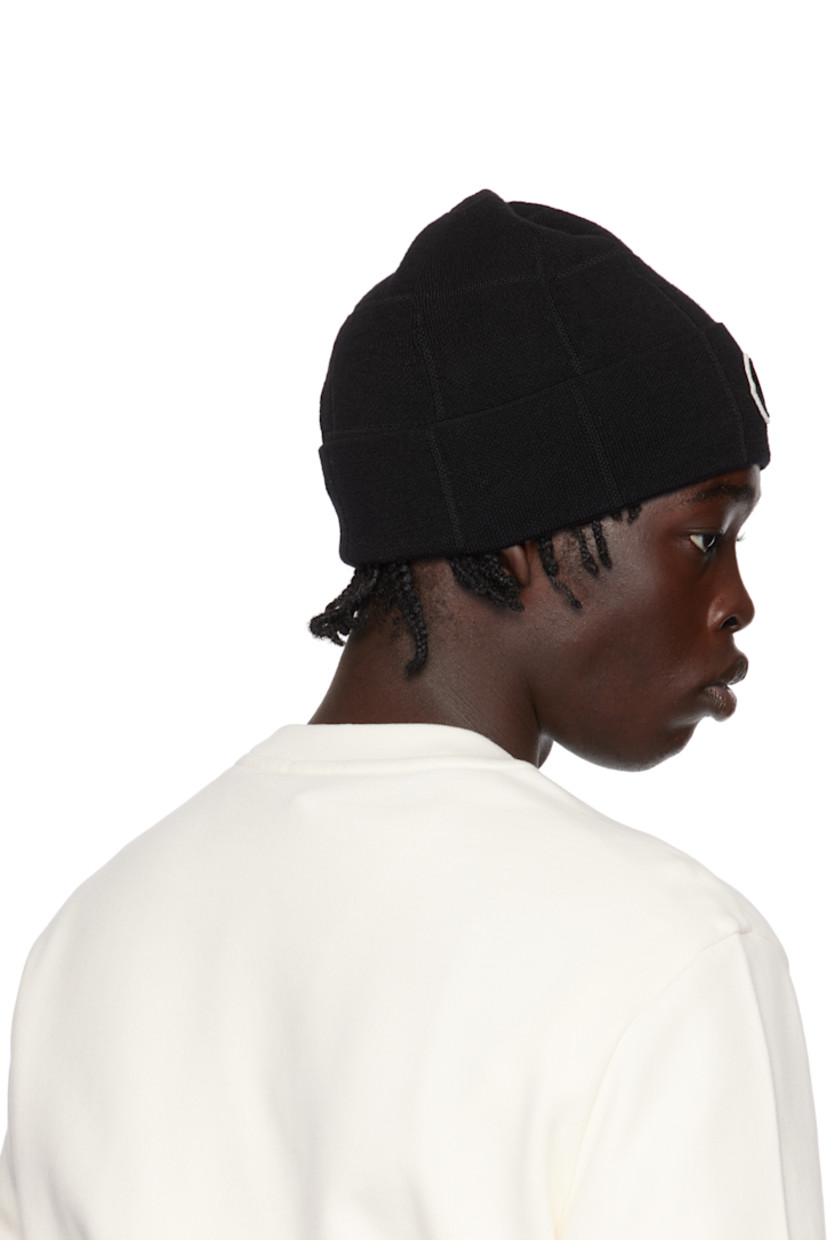 Knit stretch virgin wool-blend beanie in black. Logo patch at rolled brim. 

Part of the Moncler Genius x Palm Angels collaboration.

Supplier color: Black