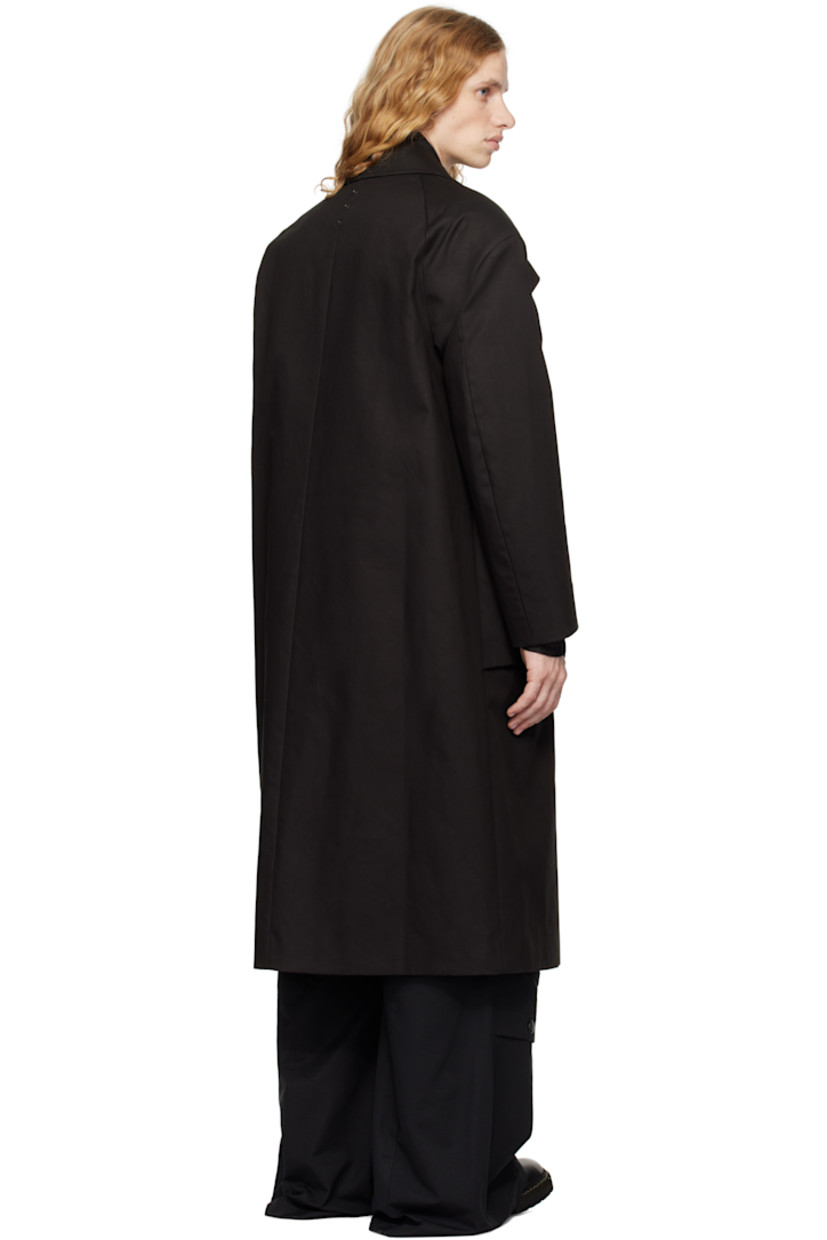 Cotton gabardine coat.

· Spread collar
· Button closure
· Flap and welt pockets
· Raglan sleeves
· Press-stud hardware at back collar
· Welt pocket at interior
· Full satin lining

Supplier color: Black