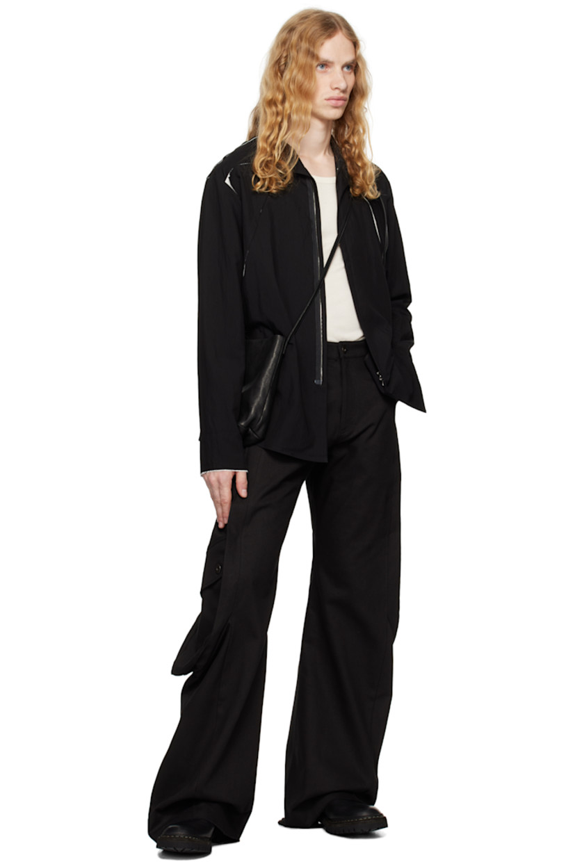 Rayon- and nylon-blend poplin jacket. Raw edges throughout.

· Paneled construction
· Spread collar
· Concealed two-way zip closure
· Exposed lining at front, shoulders, and back yoke
· Shirttail hem
· Press-stud hardware at back yoke

Supplier color: Black