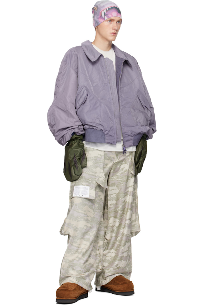 Pair of insulated nylon taffeta mittens in khaki.

· Graphic printed at top
· Integrated pocket for index finger
· Elasticized cuffs 
· Quilted lining

Supplier color: Green