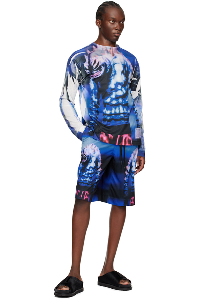 Polyester piqué shorts. Gradient effect printed throughout.

· Concealed drawstring at elasticized waistband
· Two-pocket styling
· Graphics printed at front
· Logo patch at back hem

Supplier color: Blue