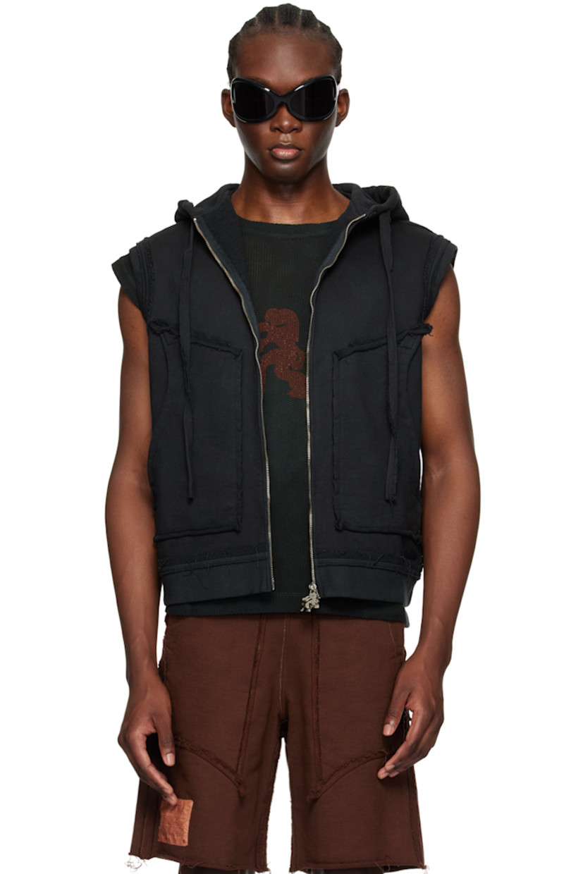 French terry hoodie. Exposed seams and raw edges throughout.

· Drawstring at hood
· Two-way zip closure
· Graphic charms at zippers
· Patch pockets
· Graphic printed on back
· Logo patch at back hem

Available exclusively at SSENSE.

Supplier color: Black