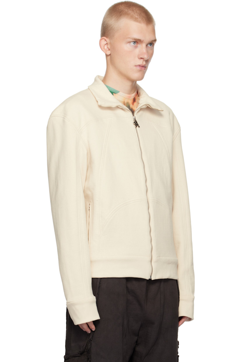 French terry jacket.

· Stand collar
· Graphic hardware at zip closure
· Zip pockets
· Graphic embroidered at back yoke

Available exclusively at SSENSE.

Supplier color: Greige