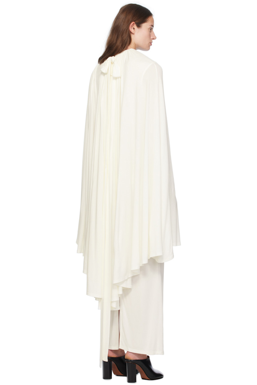 Viscose jersey dress. Cape-style overlay at shoulders.

· Self-tie fastening at round neck
· Hook-eye fastening at back collar
· Fully lined 

Supplier color: Off-White