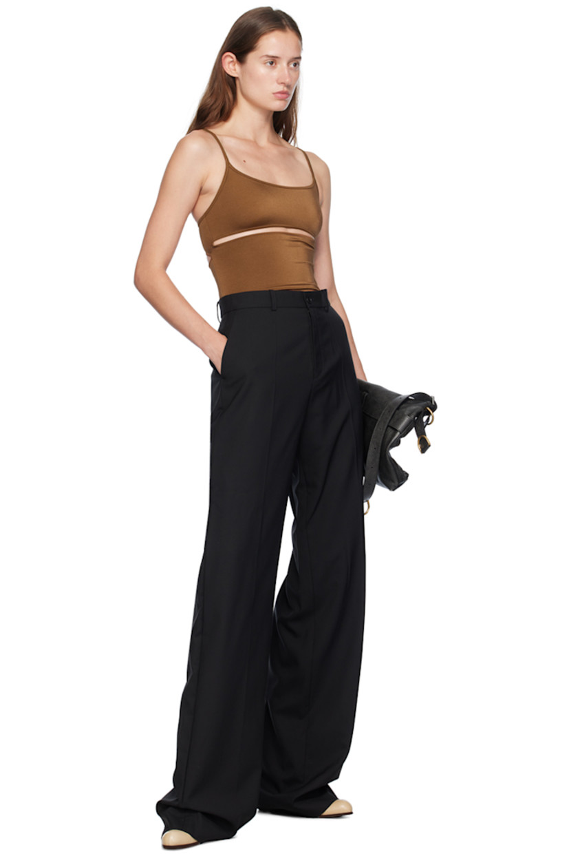 Stretch nylon jersey bodysuit.  

· Scoop neck
· Cut outs at chest, waist, and back
· Elasticized spaghetti straps
· Partially lined

Supplier color: Brown