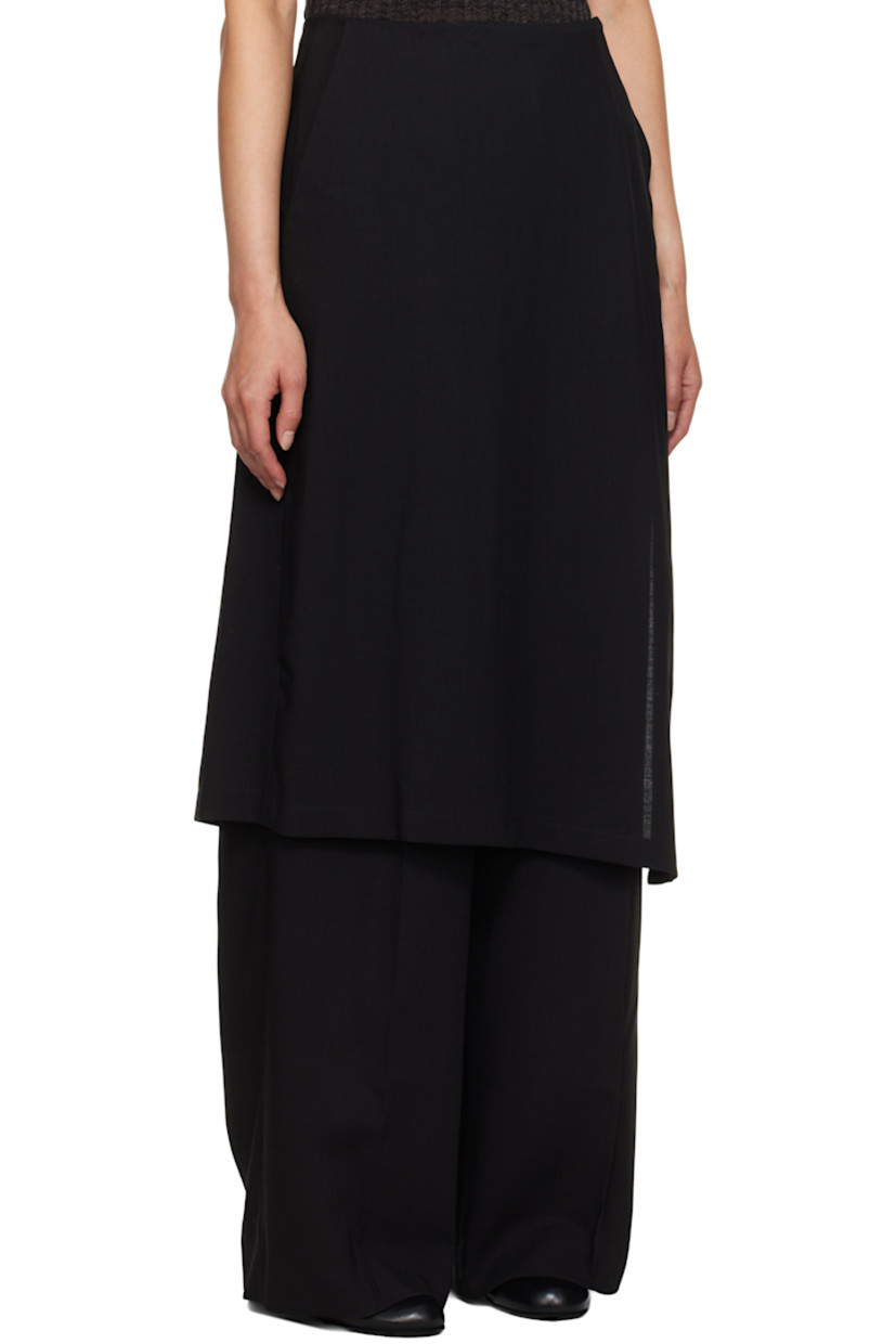 Mulesing-free virgin wool twill trousers. 

· Skirt-style overlay with button fastening 
· Four-pocket styling
· Pleats at front 
· Concealed zip closure at outseam 

Supplier color: Black