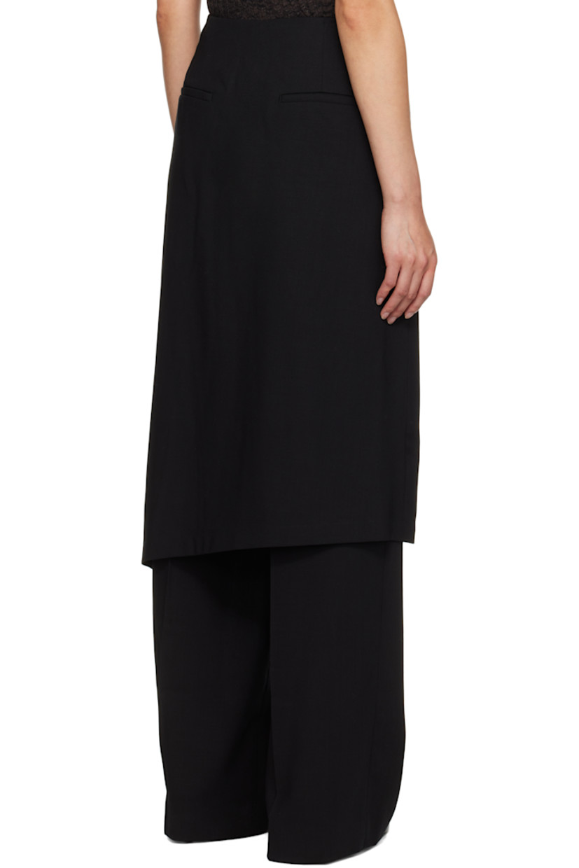 Mulesing-free virgin wool twill trousers. 

· Skirt-style overlay with button fastening 
· Four-pocket styling
· Pleats at front 
· Concealed zip closure at outseam 

Supplier color: Black