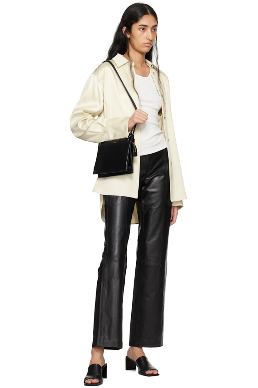 Straight-leg LWG-certified buffed lambskin pants.

· Low-rise
· Central seam at legs
· Concealed zip closure at back
· Partial TENCEL™ lyocell twill lining

Supplier color: Black