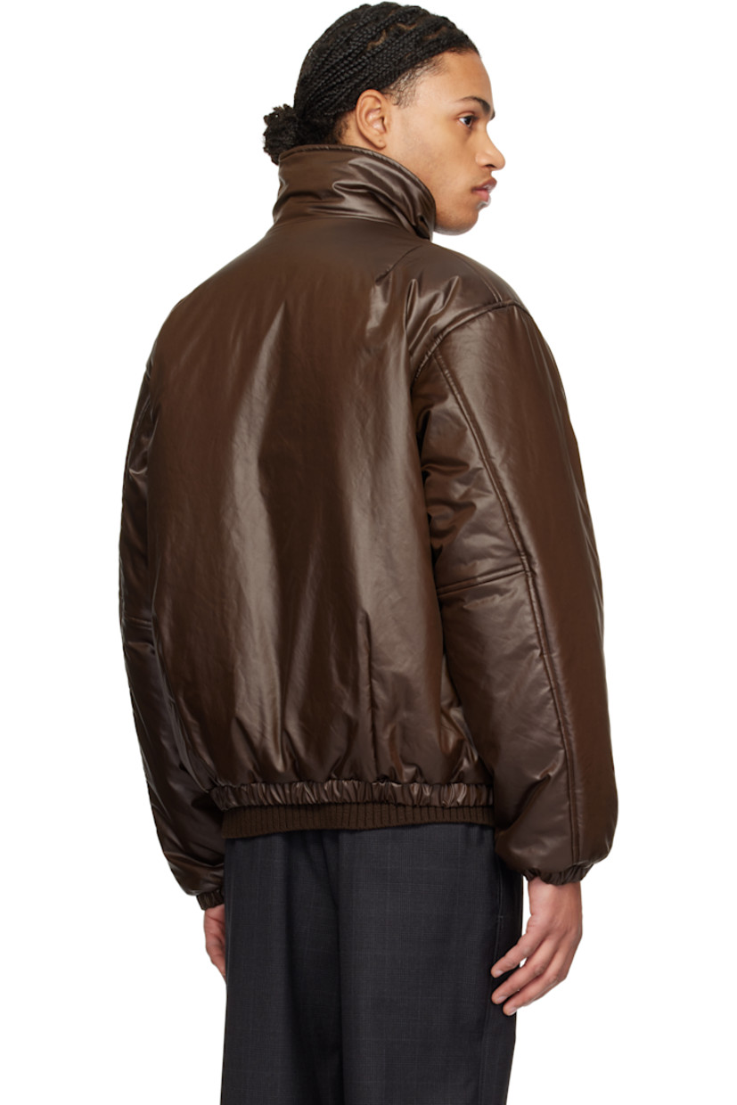 Insulated and coated polyester satin jacket. Darts throughout.

· Funnel neck
· Zip closure
· Seam pockets
· Elasticized hem and cuffs
· Plain-woven cupro lining

Supplier color: Brown