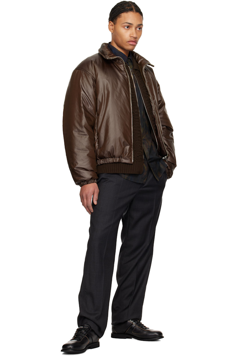 Insulated and coated polyester satin jacket. Darts throughout.

· Funnel neck
· Zip closure
· Seam pockets
· Elasticized hem and cuffs
· Plain-woven cupro lining

Supplier color: Brown