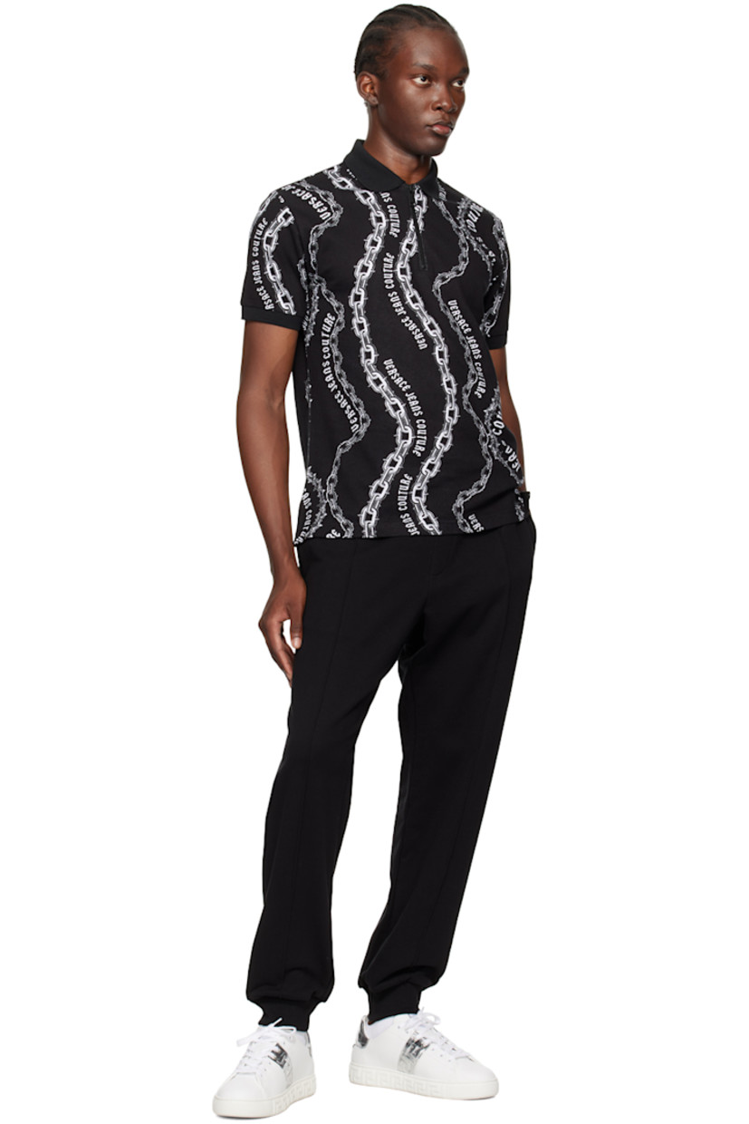 Slim-fit cotton piqué polo. Graphic pattern and logo printed throughout.

· Rib knit spread collar and cuffs
· Half-zip closure
· Tennis-tail hem

Supplier color: Black