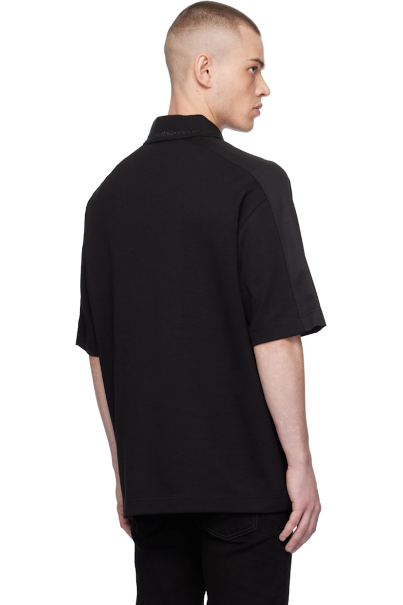 Cotton-blend interlock jersey polo. 

· Paneled construction 
· Metallic stripe at rib-knit spread collar 
· Half-zip closure 
· Logo embroidered at front 
· Mesh trim at saddle shoulders 

Supplier color: Black