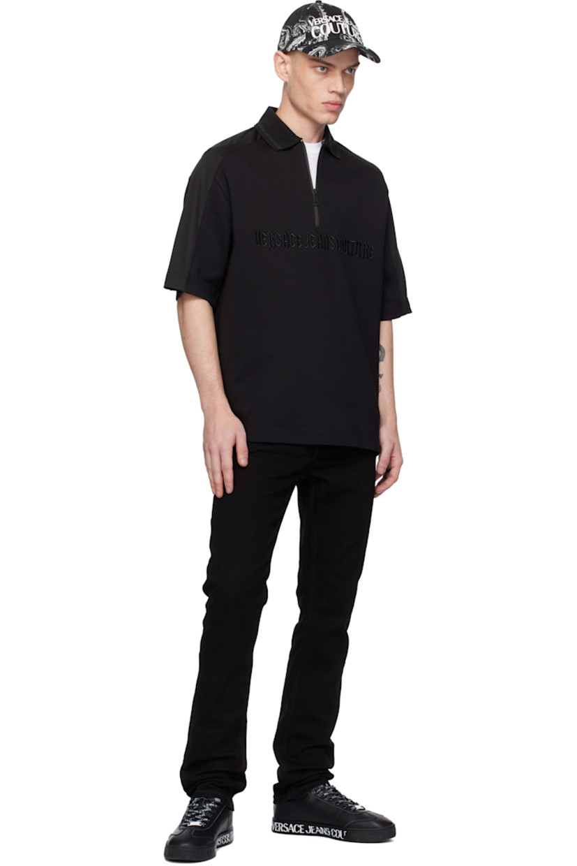 Cotton-blend interlock jersey polo. 

· Paneled construction 
· Metallic stripe at rib-knit spread collar 
· Half-zip closure 
· Logo embroidered at front 
· Mesh trim at saddle shoulders 

Supplier color: Black